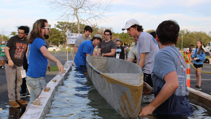 UAH engineering students racing a concrete canoe on the Bayou St. John in the 37th annual American Society of Civil Engineers