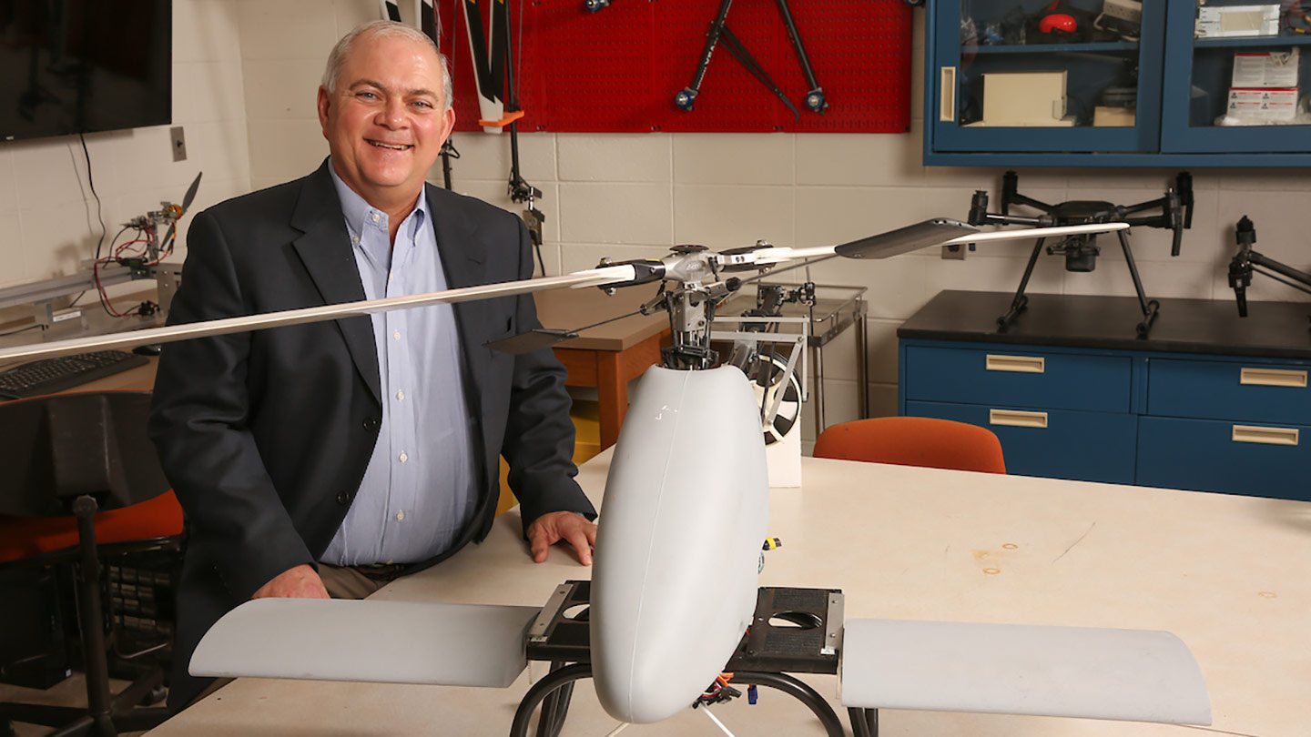 Jerry Hendrix posing with a drone