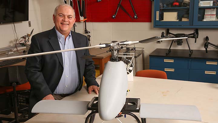 Jerry Hendrix posing with a drone
