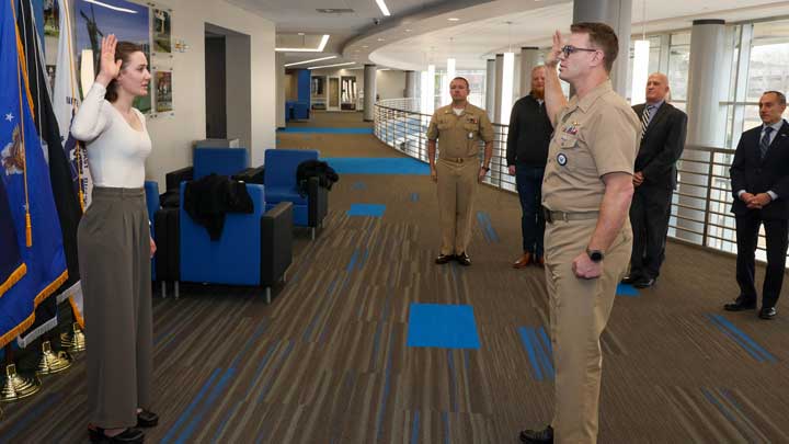 Navy Lt. Cmdr. Joshua Rogers, right, swears in Lorin Carter on Jan. 21, 2025. Carter was accepted to the Navy’s Civil Engineering Corps Collegiate Program.