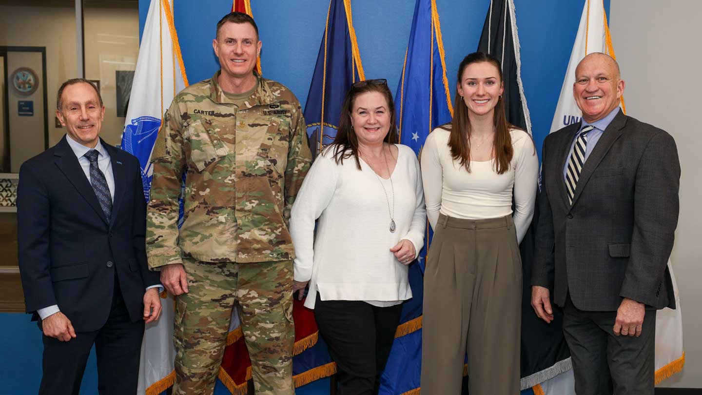 Lorin Carter, second from right, a civil engineering major at The University of Alabama in Huntsville UAH President Dr. Charles Karr, far right; UAH Provost Dr. David Puleo, far left, and her parents, Army Maj. Joseph Carter and Virginia Carter