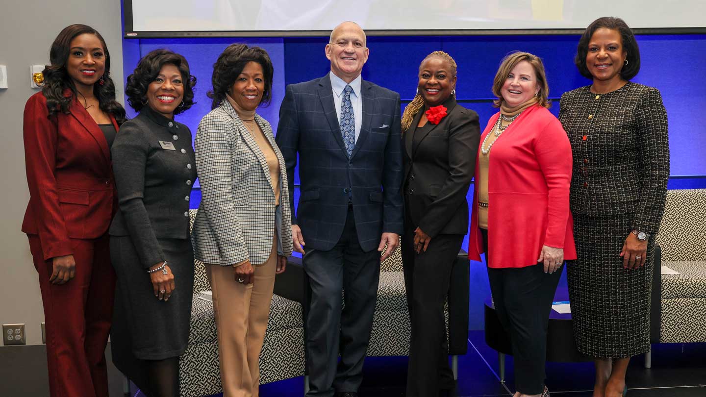 Dr. Charles Karr, center, president of The University of Alabama in Huntsville, greets speakers for the inaugural Dr. Martin Luther King Jr. Leadership Breakfast held in the UAH Student Services Building, from left, moderator Tamika Alexander; panelists Nan Baldwin, Crystal Brown, Pammie Jimmar and Erin Koshut, and keynote speaker Helena Duncan.