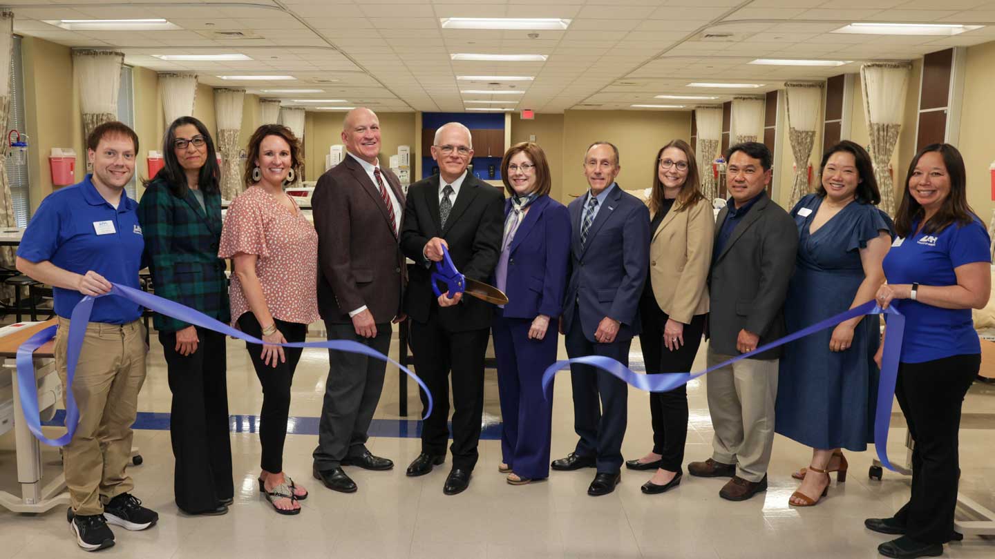 Maury Regional Medical Center has committed $145,000 to the College of Nursing at The University of Alabama in Huntsville to name the Basic to Advanced Lab in the Simulation and Learning Innovation Center. Celebrating the new partnership on April 18, 2025, are, from left, Colby Nance, SLIC specialist; Dr. Azita Amiri, CON professor and associate dean for research; Tiffany Crews, director of nursing professional development, Maury Regional; Dr. Charles Karr, UAH president; Jeff Pierce, director, human resources, Maury Regional; Dr. Karen Frith, dean, CON; Dr. David Puleo, UAH provost; Jenny Robertson, human resources lead business partner, nursing, Maury Regional; Dr. Yeow Chye Ng, CON professor and interim associate dean of graduate programs; Dr. Helen Lien, UAH senior development officer, CON, and Mary Deason, SLIC manager.