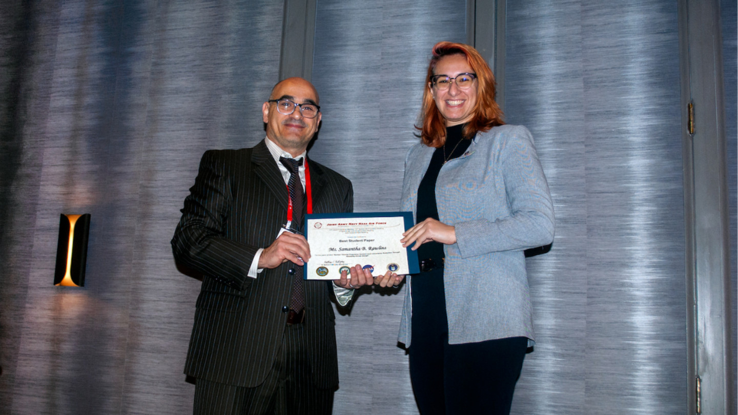 Dr. Hani Kamhawi presents Samantha Rawlins an award