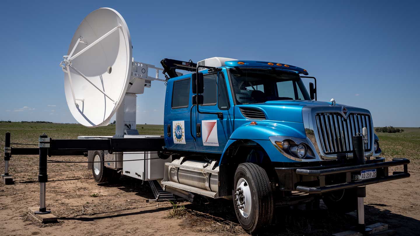 The C-band on Wheels a blue truck-mounted radar that collects weather data. It's part of the Doppler on Wheels (DOW) fleet.
