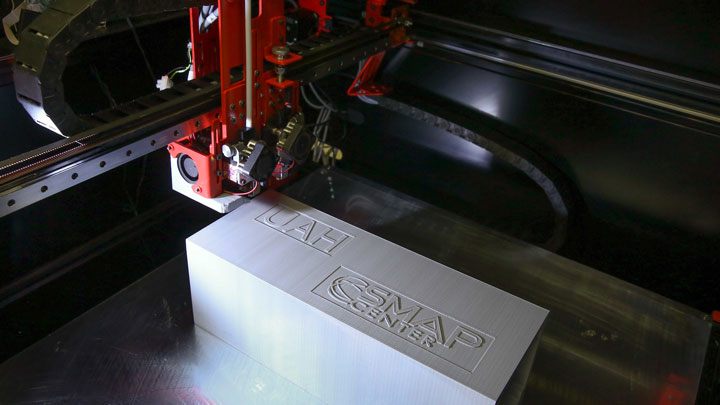 UAH Systems Management and Production (SMAP) Center 3D printer used to print Doppler Radar Gun housings, shown here printing a demonstration CubeSat container