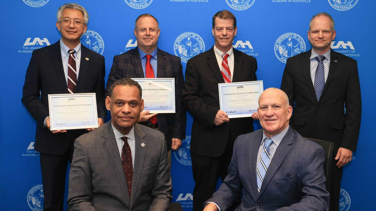 From left: Dr. Daniel K. Wims, President of AAMU, and Dr. Charles Karr, President of UAH. Back row, from left: Dr. Zhengtao Deng, Dean, College of Engineering, Technology and Physical Sciences at AAMU; Mr. John Kuenzli, IBM Army Client Account Lead – Redstone; Mr. James Lackey, COO, Davidson Technologies; and Dr. Rainer Steinwandt, Dean, College of Science at UAH.