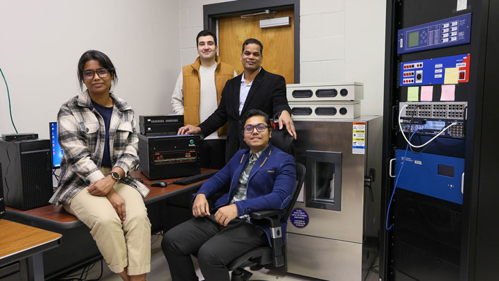 Students from The University of Alabama in the lab with the battery test equipment.