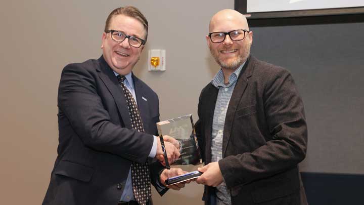 Dr. Sean Lane, left, dean, College of Arts, Humanities and Social Sciences, presents the Outstanding Faculty Award to Dr. Robert Thomson.