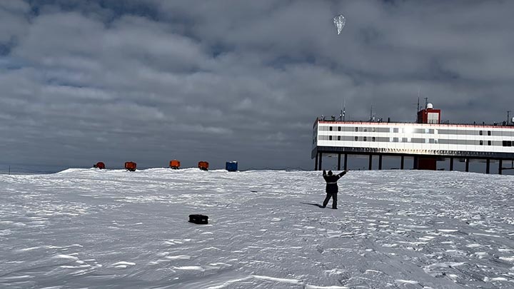 Todd McKinney launches an aerial balloon in snowy Antartica ?>