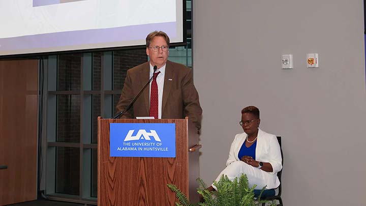 Dr. Robert Lindquist at a podium