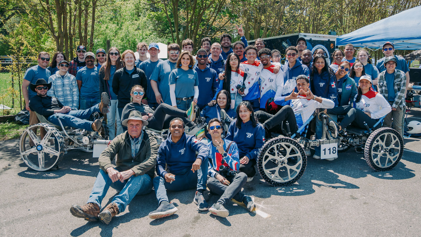 NASA Human Exploration Rover Challenge (HERC) student teams from The University of Alabama in Huntsville (UAH) and the Instituto Tecnologico de Santo Domingo (INTEC) from the Dominican Republic pose together.