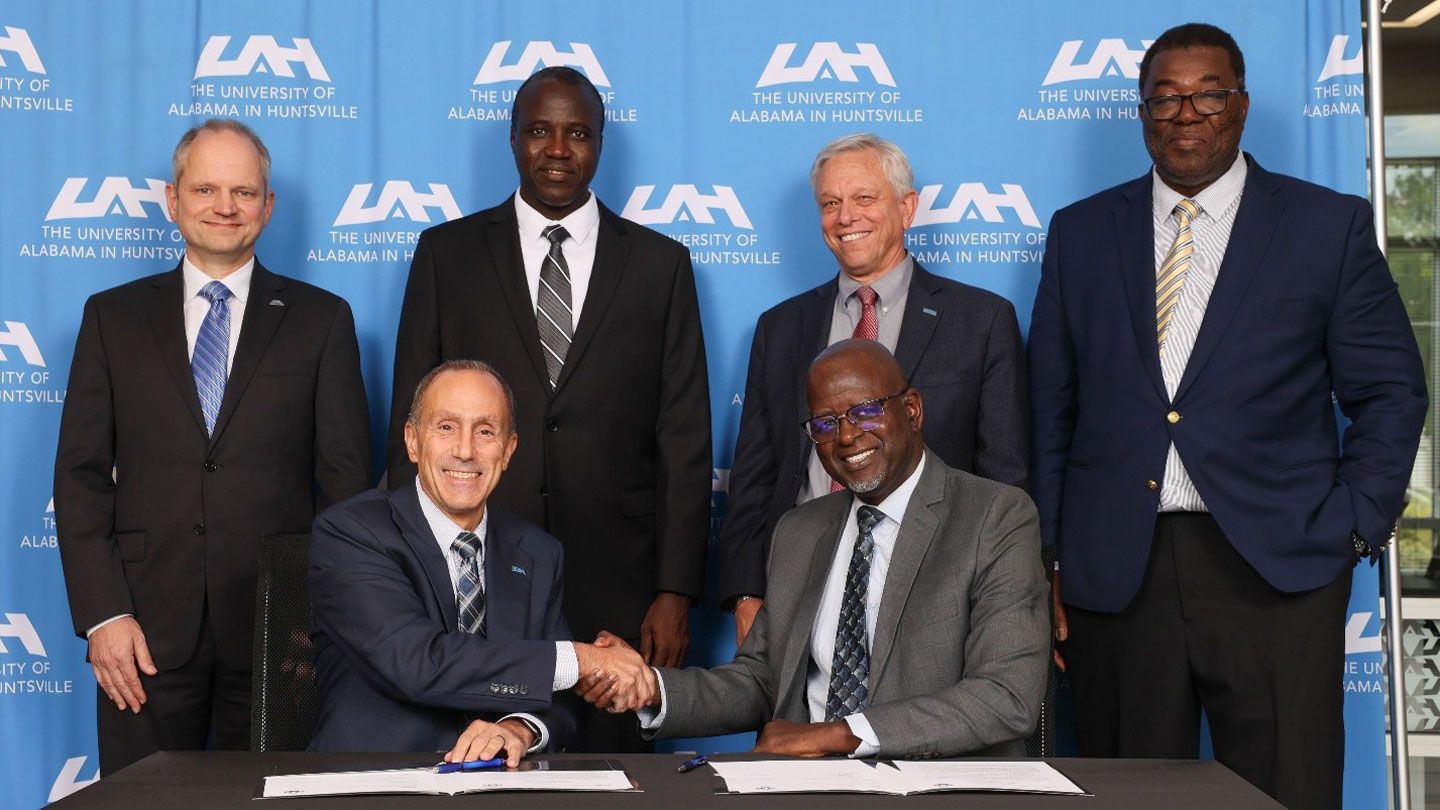 Dr. David A. Puleo, Provost and Executive Vice President for Academic Affairs at UAH, and Dr. Bassirou Lo, Dean of the Faculty of Science and Technology at UCAD, signed the agreement. Standing behind them are Dr. Rainer Steinwandt, Dean of the College of Science at UAH; Dr. Ismaila Diouf, Chair of the Department of Mathematics and Computer Science at UCAD; Dr. Jon Hakkila, Associate Provost for International Services and Dean of the Graduate School at UAH; and Dr. Toka Diagana, Professor and Chair of the Department of Mathematical Sciences at UAH. 