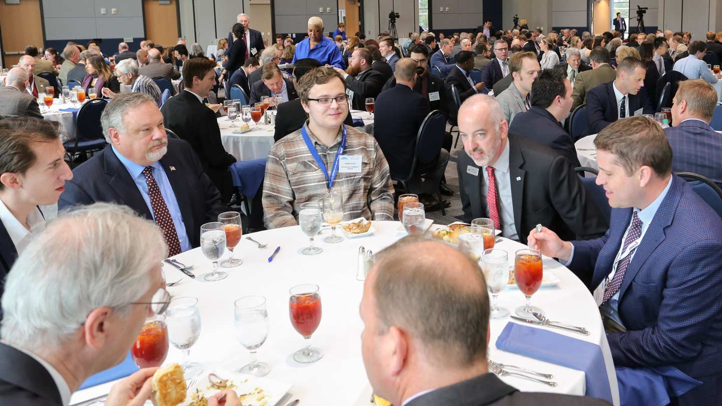 WVB Symposium participants sitting around tables