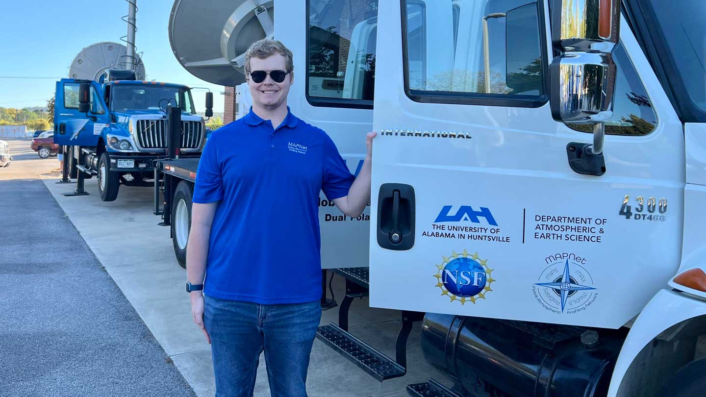Zeb Leffler stands in front of UAH’s Mobile Alabama X-Band Radar.