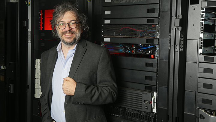 Jerome Baudry standing in a lab.