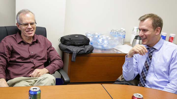 Mike Bettes chats with Dr. Kevin Knupp during a pause in Weather Channel coverage on campus in 2014.