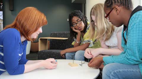 students collaborating on science project