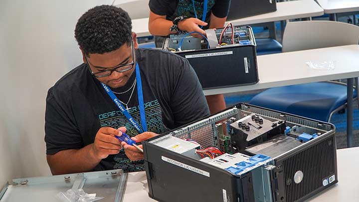 Person working on a desktop computer.