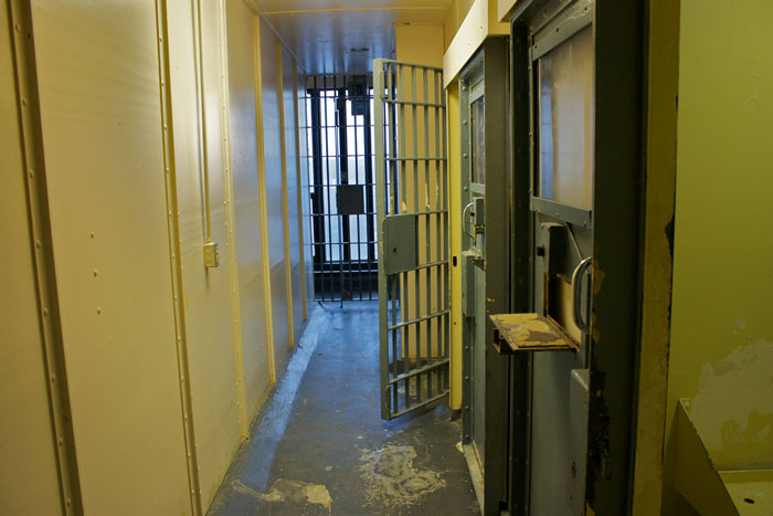 picture of an open jail cell door