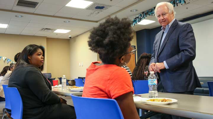 UAH President Robert Altenkirch speaks with Spring Phonathon staff