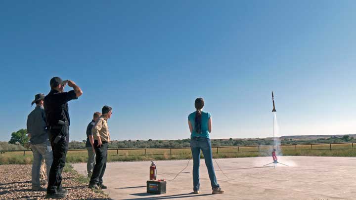 Five people launch a rocket.