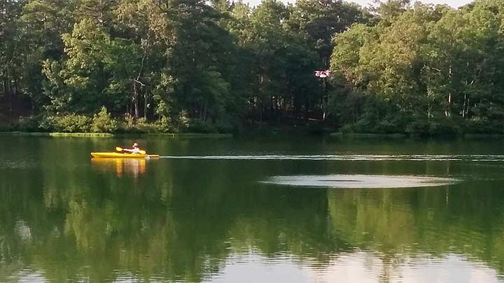 Drone hovers over water