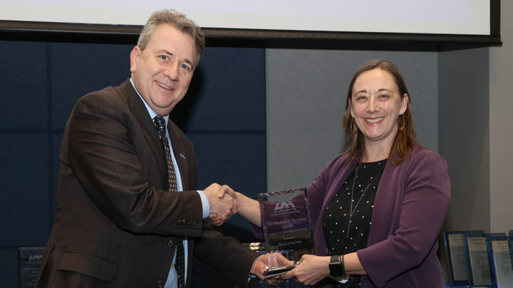 Dean Sean Lane, College of Arts, Humanities and Social Sciences, presents Outstanding Faculty Award to Dr. Nicole Pacino