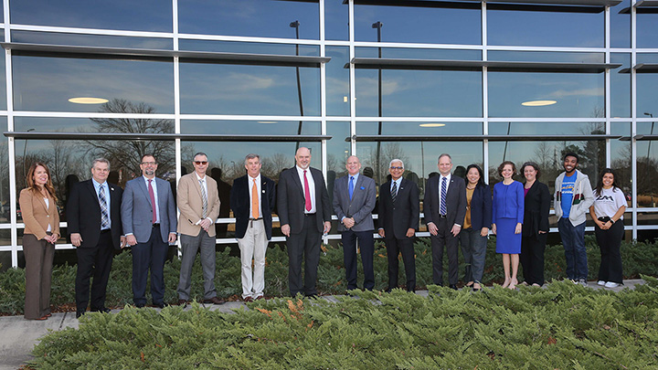 group photo in front of Avion Solutions building