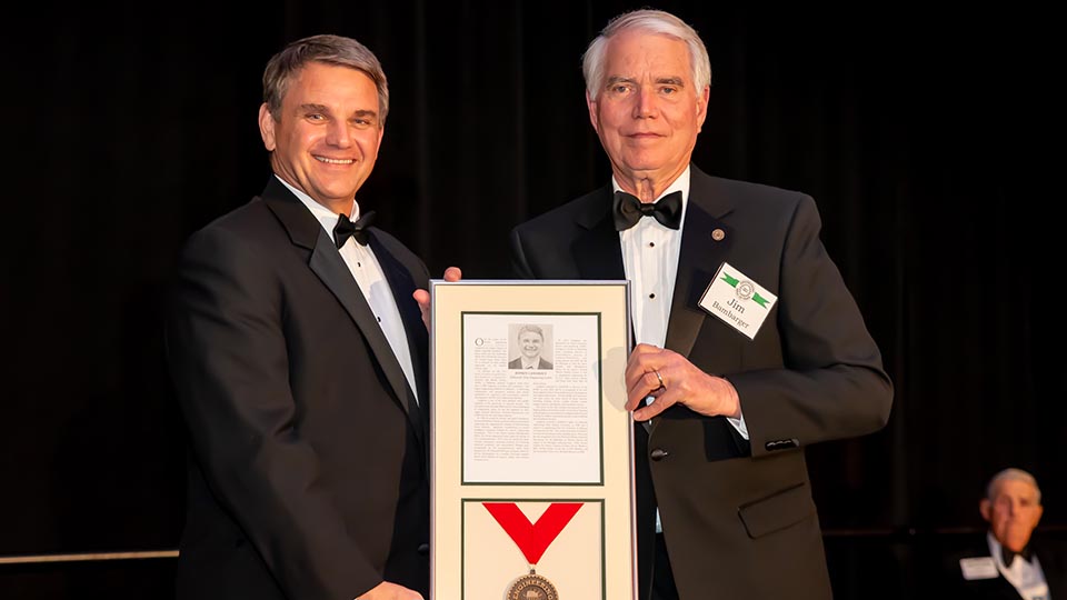 Jeffrey Langhout posing with his award