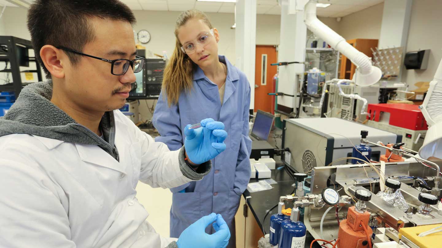 Two people looking at their lab work