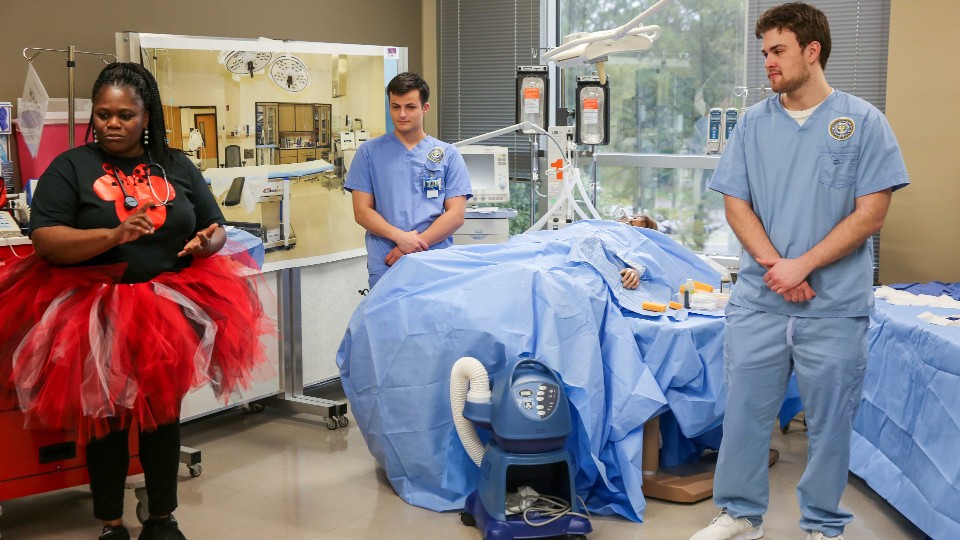 students and participants in a mock hospital setting