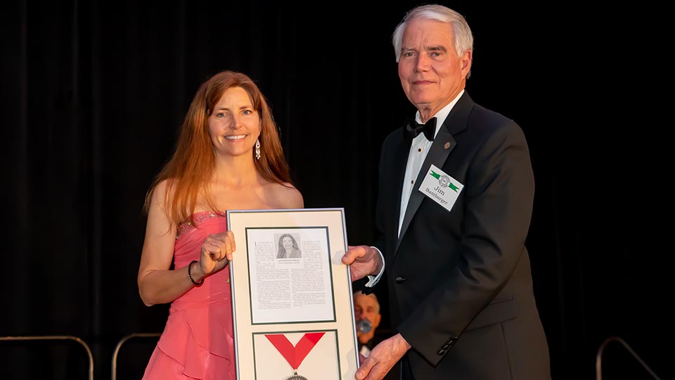 Lisa Watson-Morgan posing with her award