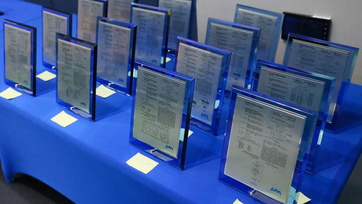 a dozen plaques setting on a table.