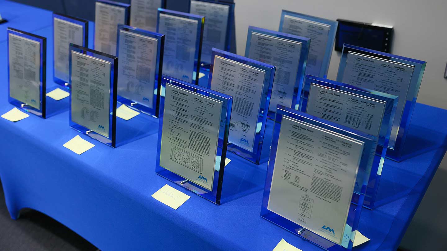 a dozen plaques setting on a table.