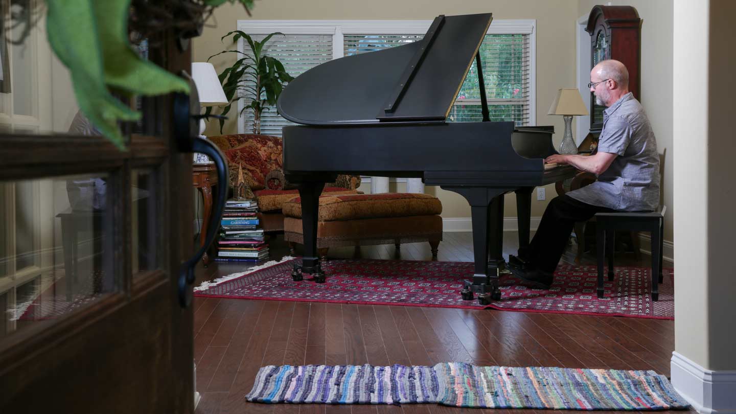 Ron Guthrie playing piano.