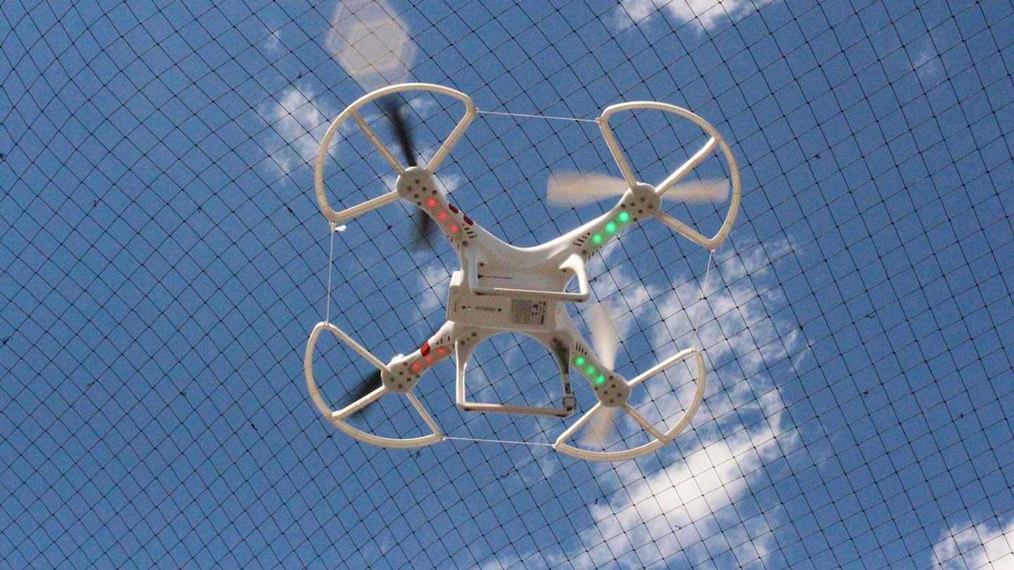 An unmanned aerial vehicle makes an inaugural flight in the Systems Management and Production Center’s new test enclosure.