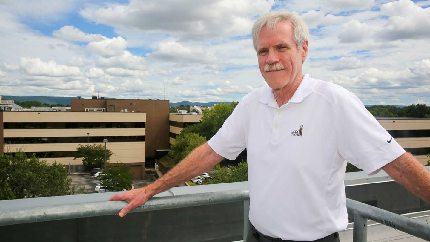 Dr. John Christy outdoors on a rooftop