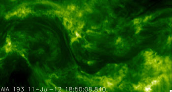 Courtesy NASA
    These photos of the solar corona, or million-degree outer atmosphere, show the improvement in resolution offered by NASA's High Resolution Coronal Imager, or Hi-C (bottom), versus the Atmospheric Imaging Assembly on NASA's Solar Dynamics Observatory (top). Both images show a portion of the sun's surface roughly 85,000 by 50,000 miles in size. Hi-C launched on a sounding rocket on July 11, 2012, in a flight that lasted about 10 minutes. The representative-color images were made from observations of ultraviolet light at a wavelength of 19.3 nanometers (25 times shorter than the wavelength of visible light).