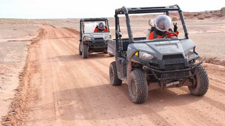 team members driving utilities vehicles