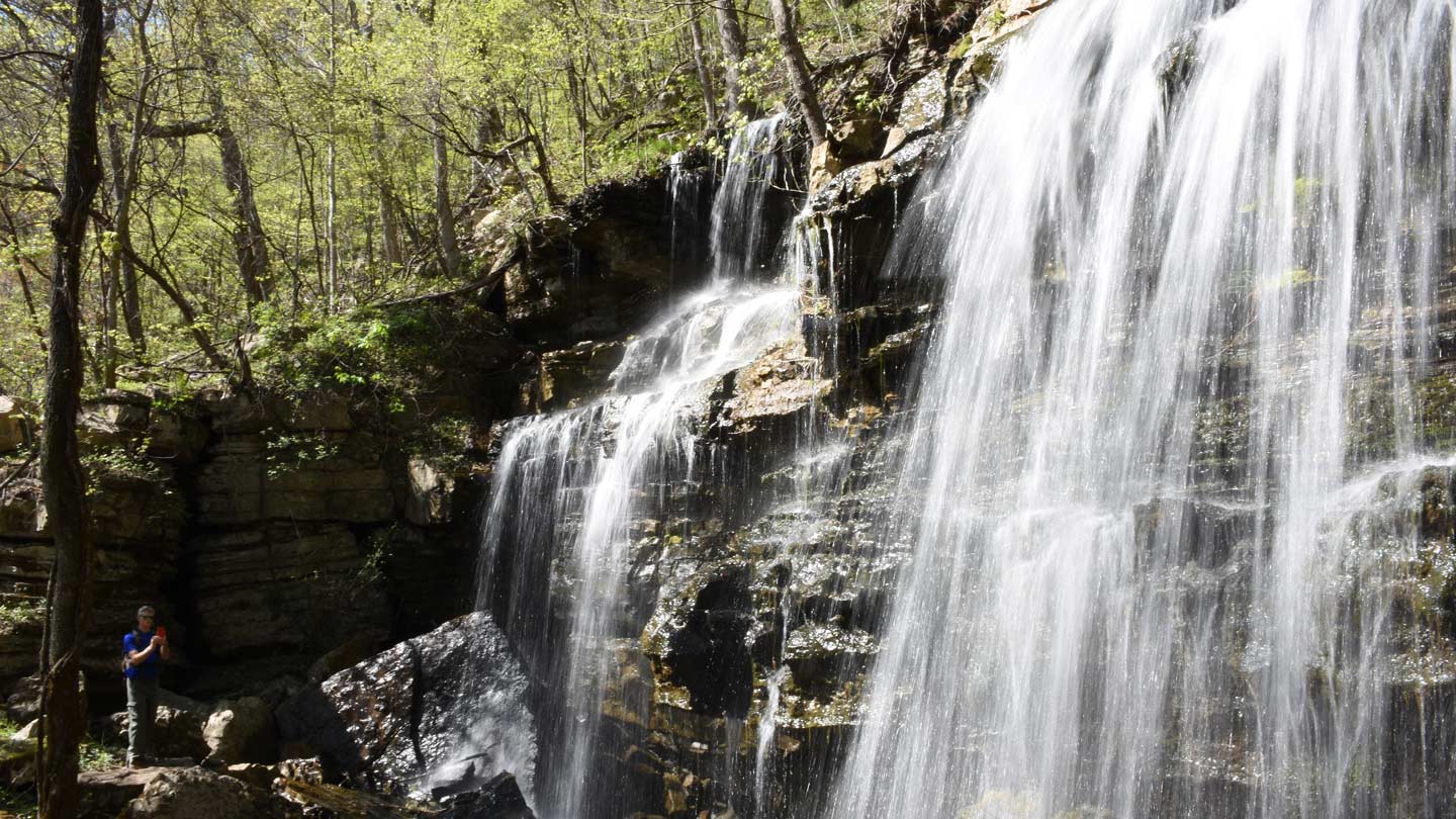 Stallsmith in front of a waterfall