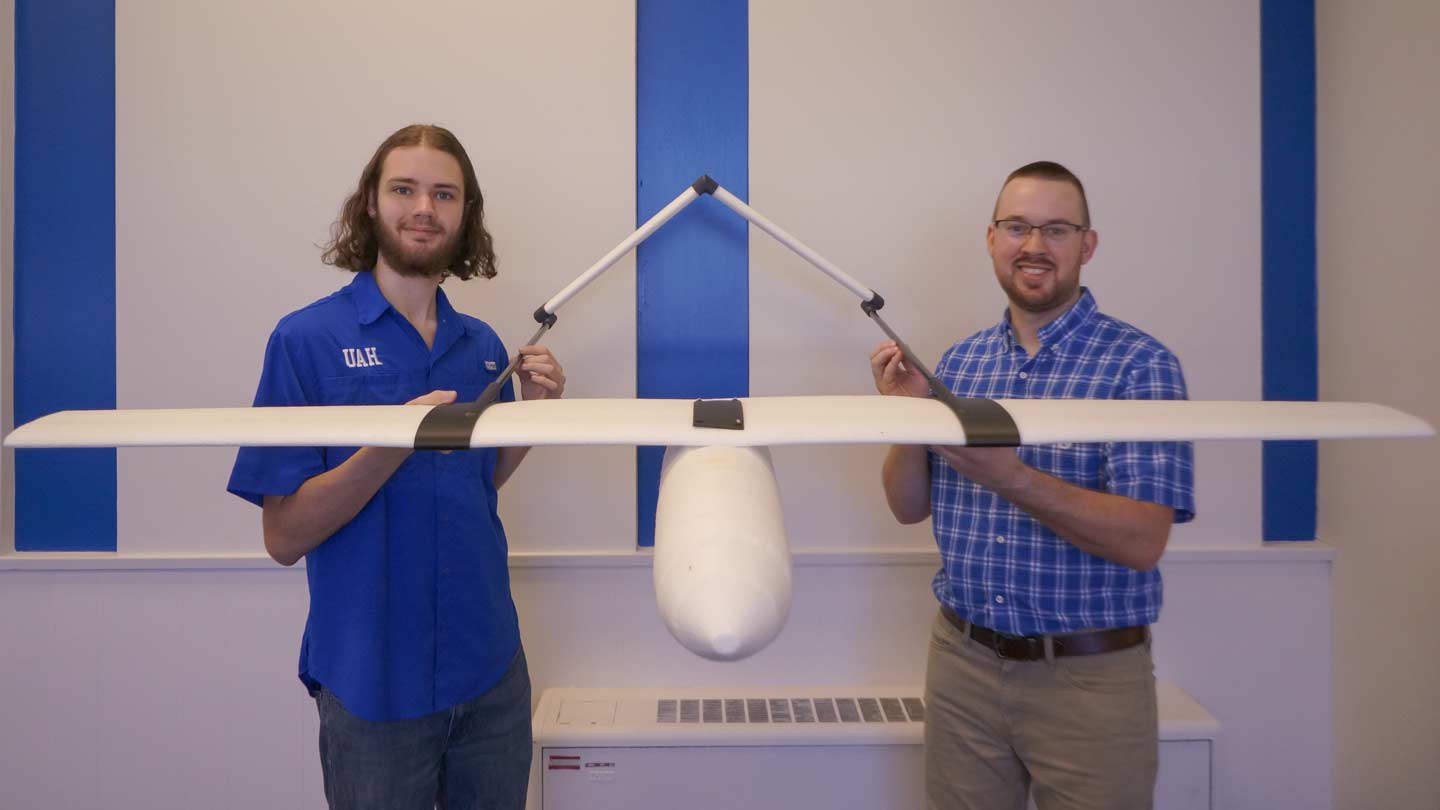 Chris Sallis and Nick Balch hold their rigid closed cell foam fixed-wing aircraft