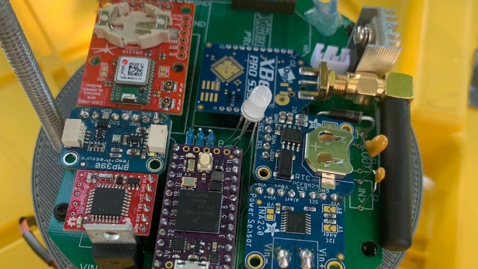 a view inside of the CanSat showing circuits and computer parts