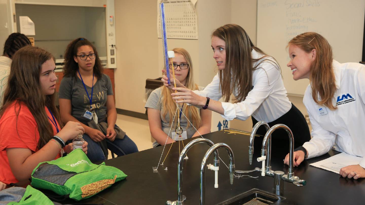 girls experimenting in science lab