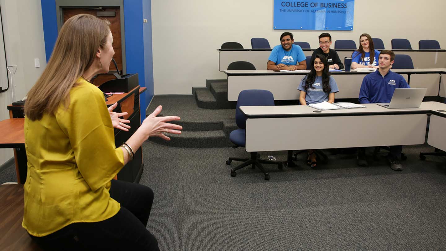 Classroom with prospective view from faculty speaking to students.