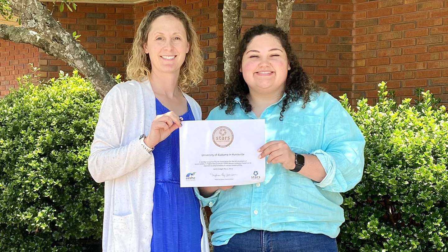 Claire and Sameera posing with certificate