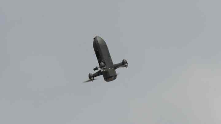 Bullet shape drone flying in air with rotory propellant.