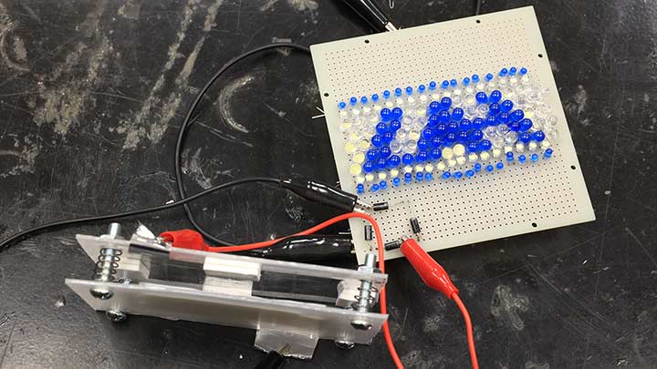 wires, circuits, and cables arranged on a table.