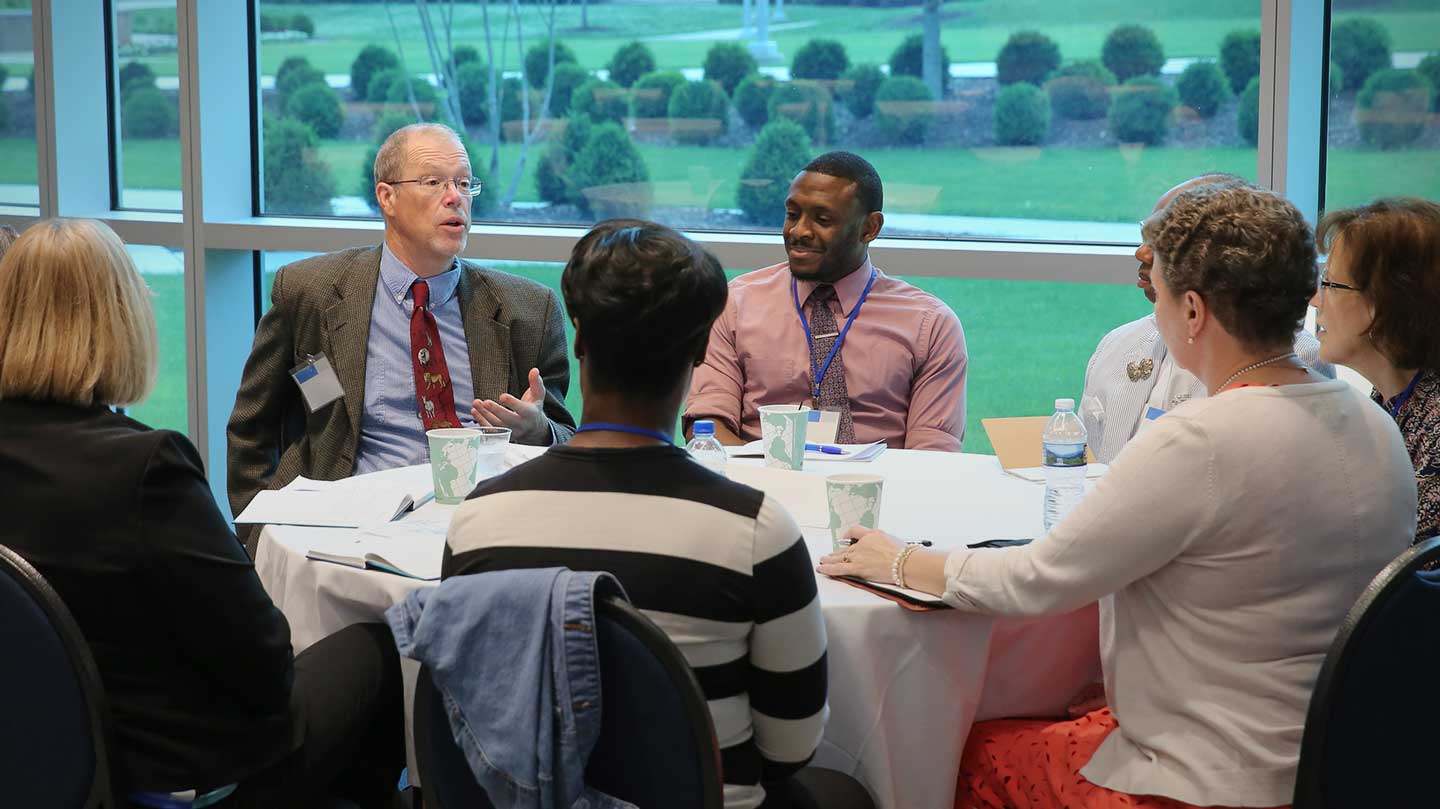 professionals engaged in small group discussion