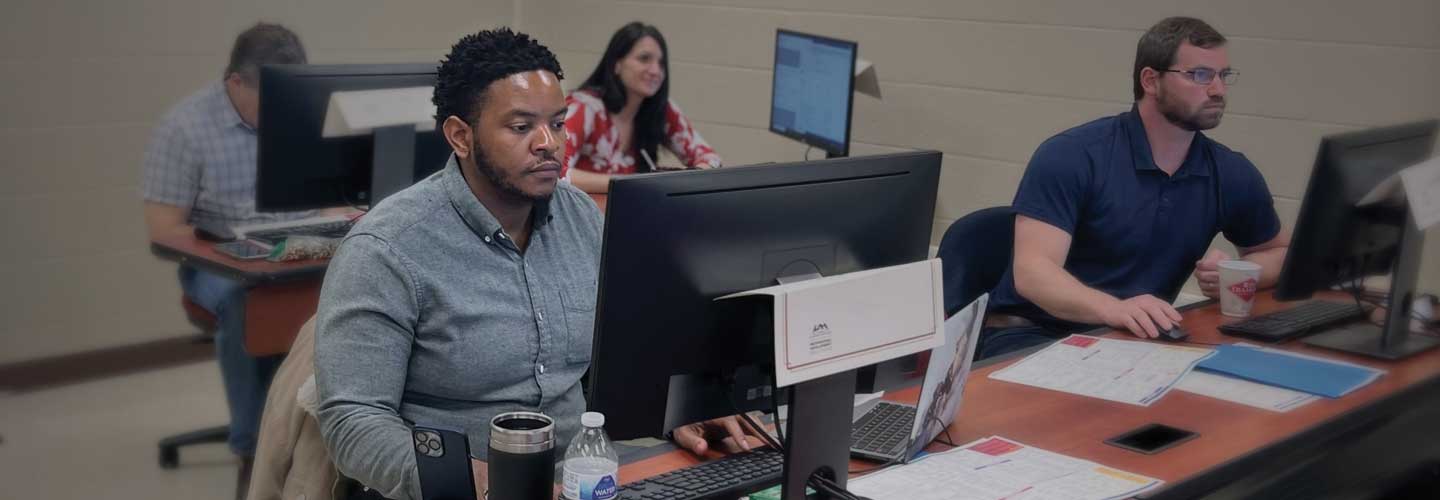 Group taking a computer course.